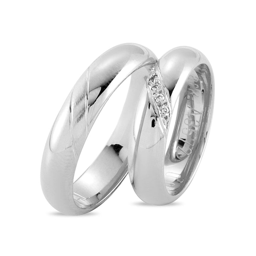 Smukke Nuran vielsesringe i 14 kt hvidguld med 0,04 ct diamanter og blank overflade.